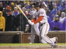  ?? Jonathan Daniel / Getty Images ?? Michael A. Taylor’s grand slam in the rain in the eighth inning broke open the game for Washington.