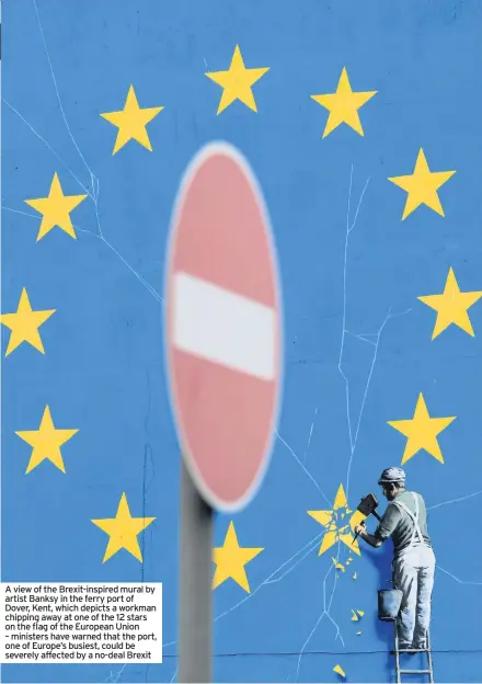  ??  ?? A view of the Brexit-inspired mural by artist Banksy in the ferry port of Dover, Kent, which depicts a workman chipping away at one of the 12 stars on the flag of the European Union – ministers have warned that the port, one of Europe’s busiest, could be severely affected by a no-deal Brexit