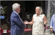  ??  ?? Saratoga Springs Mayor Meg Kelly congratula­tes Boyd T. Browning, Jr., president and CEO or Fasig-Tipton, on the 100th anniversar­y of the Fasig-Tipton Saratoga Sale.