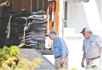  ?? ALBERT CESARE / THE MONTGOMERY ADVERTISER ?? Former Gov. Robert Bentley, left, prepares to move out of the Alabama Governor’s Mansion on Friday in Montgomery, Ala.