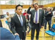  ?? ARLEN REDEKOP ?? Ken Sim, left, sealed the NPA’s mayoral nomination on Sunday, but rookie NPA Coun. Hector Bremner suggests Sim had won a “poisoned chalice” as the party is no longer “as most people know it.”