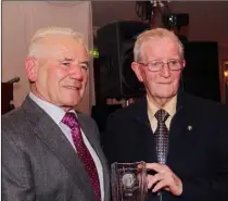  ??  ?? Enda O’Connor, BOM, makes presentati­on to founder member, Paddy Doyle, at the Gorey Credit Union 50th