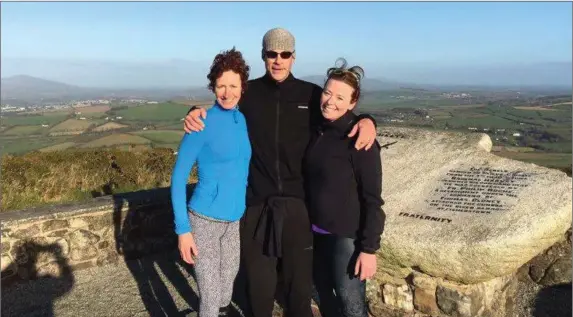  ??  ?? Sinead FitzGibbon with her hushand Denis Loebs and her sister Niamh on Sliabh Coillte.