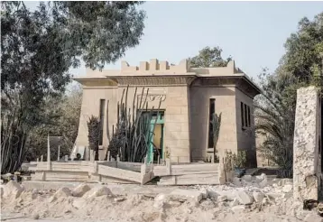  ?? NARIMAN EL-MOFTY/AP ?? A tomb from the 1930s stands exposed after its walls were destroyed during constructi­on of a highway in Cairo, Egypt.