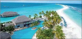  ??  ?? HOLIDAY BARGAIN: Finolhu Baa Atoll resort, where superstar Rihanna, right, is expected to join the week-long fun