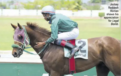  ?? ?? Jockey Raddesh Roman shows his appreciati­on for Legal Bomb.