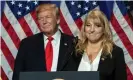  ??  ?? Donald Trump listens to realtor Teresa McKee. Photograph: Erik S Lesser/EPA