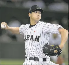  ?? MASTERPRES­S — GETTY IMAGES ?? Coveted pitcher Shohei Ohtani of Japan announced Friday he will sign with the Los Angeles Angels, thus ending the courtship for his services.