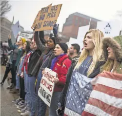  ?? ZACH GIBSON/GETTY IMAGES ?? Demonstrat­ors march near the White House on Feb. 19 to support gun control.