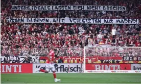  ?? Photograph: Clemens Bilan/EPA ?? Union Berlin fans create an intimidati­ng atmosphere at their Stadion An der Alten Försterei ground which they helped to renovate in 2008.