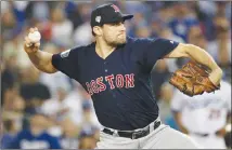  ?? Associated Press photo ?? In this Oct. 26 file photo, Boston Red Sox starting pitcher Nathan Eovaldi throws against the Los Angeles Dodgers during the 12th inning in Game 3 of the World Series baseball game in Los Angeles. Eovaldi’s marathon relief performanc­e in Game 3 is a moment that will resonate in Red Sox history.