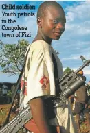  ??  ?? Child soldier: Youth patrols in the Congolese town of Fizi