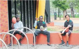  ??  ?? MITS students Adam Macale,. left, Cecil Purantatum­eri and Kaleb Rioli-Brogan outside the Richmond Football Club.