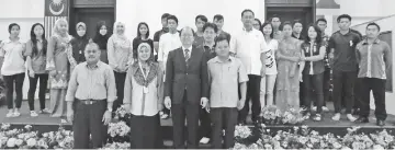  ??  ?? Tangau (front, second right) and Muliati (front, second left), with the students from Tuaran who received the WPP.