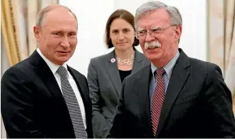  ??  ?? Russian President Vladimir Putin, left, and US National security adviser John Bolton meet at the Kremlin in Moscow yesterday.