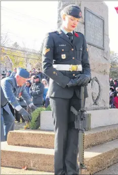  ?? SARAH EHLER ?? A cadet bows her head as wreaths are laid at the Kentville cenotaph.