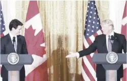  ??  ?? US President Donald Trump (right) and Canadian Prime Minister Justin Trudeau