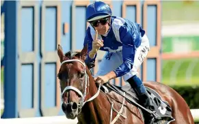  ?? GETTY IMAGES ?? Winx and rider Hugh Bowman take the Apollo Stakes yesterday.