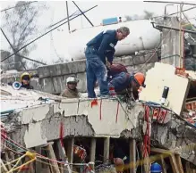  ??  ?? Race against time: Rescuers sifting through debris for survivors at the Enrique Rebsamen school. — Reuters