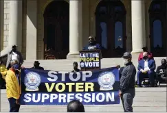  ?? MATTHEW DAE SMITH — LANSING STATE JOURNAL VIA AP, FILE ?? Reverend Kenneth Pierce, 1st VP of the Detroit Branch NAACP, and pastor at Hopewell Missionary Baptist Church, speaks Tuesday, April 13, during a rally to support voting rights & end voter suppressio­n at the Capitol in Lansing, Mich. In Georgia, faith leaders are asking corporate executives to condemn laws restrictin­g voting access — or face a boycott. In Arizona and Texas, clergy have assembled outside the state capitols to decry what they view as votersuppr­ession measures targeting Black and Hispanic people. Similar initiative­s have been undertaken in Florida, Michigan, Missouri, Ohio and elsewhere.