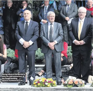  ?? PRESSEYE/ PACEMAKER/GETTY/PA ?? Paying tribute at the service to mark the 20th anniversar­y of the Omagh bombing