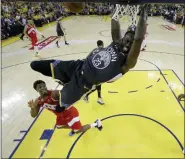  ?? TONY AVELAR — THE ASSOCIATED PRESS FILE ?? This file photo shows Golden State Warriors forward Draymond Green (23) dunking over Toronto Raptors guard Kyle Lowry, left, and forward Kawhi Leonard (2) during the first half of Game 6 of basketball’s NBA Finals in Oakland A person familiar with the situation says the Warriors and Green have agreed on a four-year extension worth nearly $100 million, meaning the three-time All-Star is under contract through the 2023-24 season. Green and the Warriors intend to make the deal official imminently, according to the person who spoke to The Associated Press on condition of anonymity Saturday because it has not been finalized.