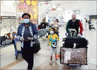  ?? Photo by Bassam Abu Shanab ?? Kuwaiti evacuated family members seen at the arrival hall, keeping with the State’s measures to help nationals
abroad return home amid the coronaviru­s outbreak.