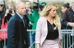  ?? SETH WENIG/AP 2018 ?? Attorney Michael Avenatti, seen here with former client Stormy Daniels, was sentenced Thursday to four years in prison for cheating Daniels of book proceeds.