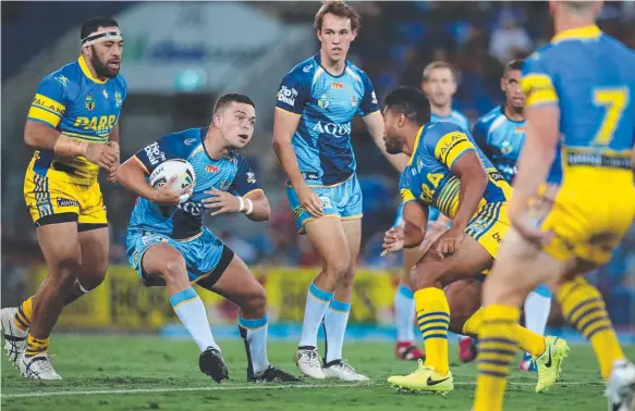  ?? Picture: SCOTT FLETCHER ?? Titans halfback Ash Taylor on the attack in last night’s win over Parramatta on the Gold Coast.