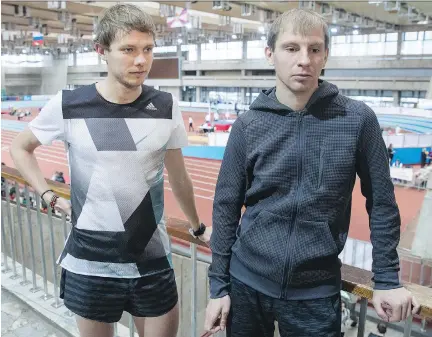  ?? PAVEL GOLOVKIN/THE ASSOCIATED PRESS ?? Vasily Permitin, left, and Evgeny Pishchalov, part of the Rocket Science Project, speak with The Associated Press at the Russian Indoor Championsh­ips in Moscow last week. Pishchalov says doping has kept Russia “20 years behind” on sports technology.