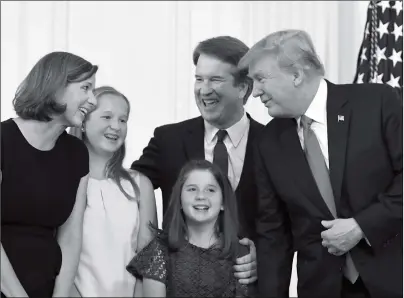  ?? Photo: AFP ?? US President Donald Trump (right) speaks to US Judge Brett Kavanaugh and his family after nominating him to the Supreme Court in the East Room of the White House on Monday in Washington, DC