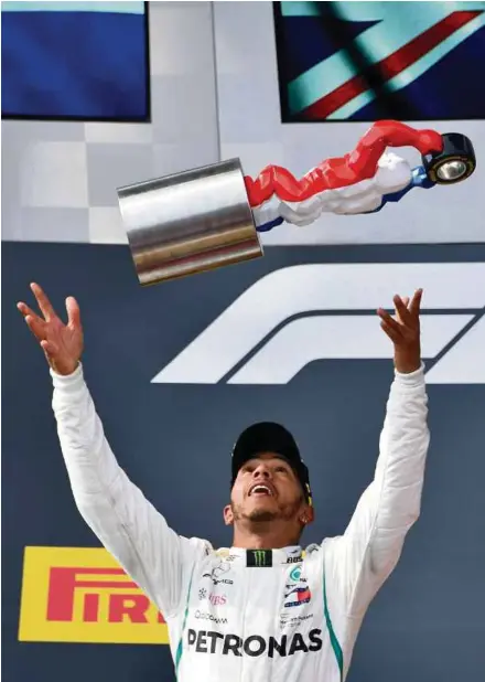  ?? AFP PIC ?? Mercedes’ Lewis Hamilton celebrates on the podium after winning the French Grand Prix at the Paul Ricard Circuit in Le Castellet yesterday.