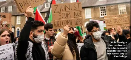  ?? ?? Mob: the signs that confronted Israeli Ambassador Tzipi Hotovely on her recent trip to Cambridge