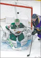  ?? The Associated Press ?? Jeff Roberson Wild goaltender Kaapo Kahkonen watches the puck in front of Blues right wing Vladimir Tarasenko in the first period of St. Louis’ 9-1 win Friday at Enterprise Center.