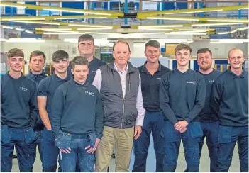  ?? ?? INVESTING: Chairman Gerard Eadie with some of CR Smith’s new apprentice­s.