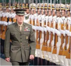  ??  ?? BEIJING: Joint Chiefs Chairman Gen Joseph Dunford reviews a Chinese honor guard during a welcome ceremony at the Bayi Building in Beijing yesterday. — AP