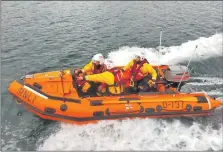  ?? ?? As helm, Carla Jackson, back, will be responsibl­e for the inshore lifeboat and the safety of its crew.