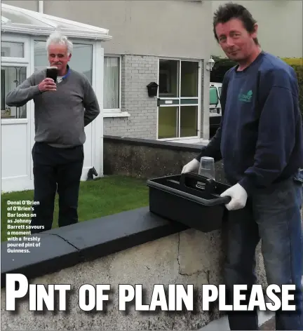  ??  ?? Donal O’Brien of O’Brien’s Bar looks on as Johnny Barrett savours a moment with a freshly poured pint of Guinness.