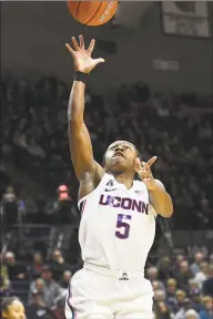  ?? Stephen Dunn / Associated Press ?? UConn’s Crystal Dangerfiel­d (5) shoots during the second half against California on Sunday in Storrs.