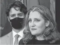  ?? REUTERS ?? Deputy Prime Minister and Finance Minister Chrystia Freeland speaks to reporters next to Prime Minister Justin Trudeau on Parliament Hill in Ottawa in this file photo.