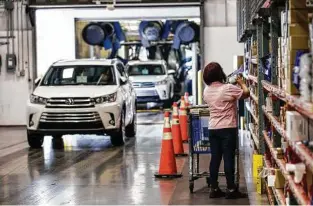  ??  ?? Accessorie­s are added to vehicles at Gulf States Toyota after they are washed.