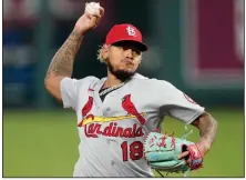  ?? (AP file photo) ?? St. Louis Cardinals pitcher Carlos Martinez battled covid-19 last summer and said he wasn’t the same the rest of the season. As pitchers and catchers reported to spring training Wednesday, major league players and managers say they have a better understand­ing of what it takes to play baseball through a pandemic.