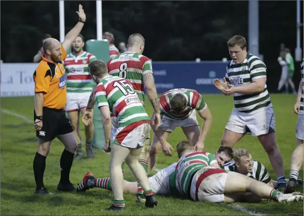  ??  ?? Chris Simmonds has his try awarded during the AIL Division 2B clash with Sundays Well in Dr Hickey Park last weekend.