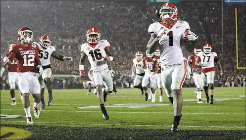  ?? AP/JAE C. HONG ?? Georgia running back Sony Michel (1) scores the winning touchdown in the second overtime to give the Bulldogs a 54-48 victory over Oklahoma in the Rose Bowl on Monday in Pasadena, Calif. It was the third touchdown of the game for Michel, who finished...