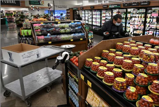  ?? RJ SANGOSTI — THE DENVER POST ?? An employee at a Safeway store sorts produce on March 1, 2023, in Aurora.