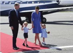  ??  ?? BERLIN: Britain’s Prince William, left and Kate, the Duchess of Cambridge, second right, arrive with their children, Prince George, second left and Princess Charlotte, at Tegel airport in Berlin. —AP