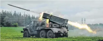  ?? ?? A rocket is launched from a truck-mounted multiple rocket launcher near Svyatohirs­k, eastern Ukraine.