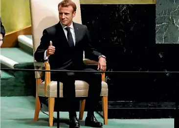  ?? AP ?? France’s President Emmanuel Macron gives a thumbs up as he waits to address the 73rd session of the United Nations General Assembly, at UN headquarte­rs in New York yesterday.