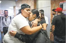  ?? Amy Osborne / Special to The Chronicle ?? Family and friends of victim Abel Enrique Esquivel Jr., who was slain with a revolver stolen from an S.F. police officer’s car, gather outside the courtroom after the arraignmen­t of a murder suspect.