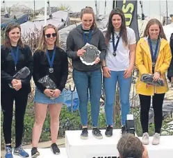  ??  ?? Anna Sturrock and helm Bella Fellows in action, top, and on the winners’ podium.